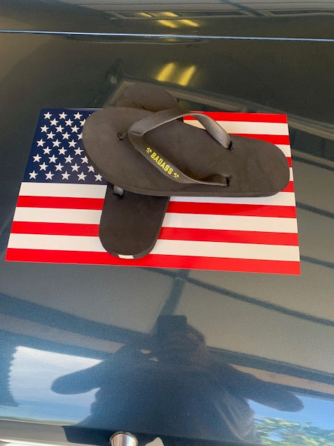 BADASS black sandal with gold branding on American flag